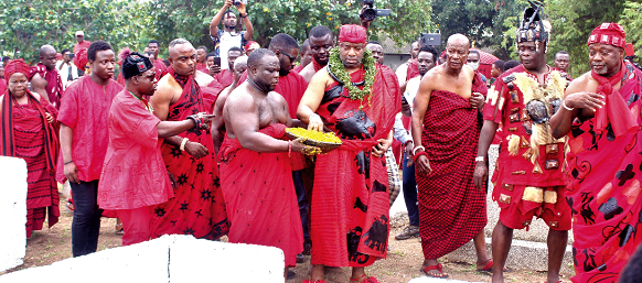 King Tackie Tawiah II, the Ga Mantse sprinkling kpokpoi at the Royal Mausoleum, Tesano. Picture: Ernest Kodzi